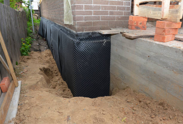 SJ Waterproofing Pros technician performing targeted Waterproofing assessment in Webster, NY
